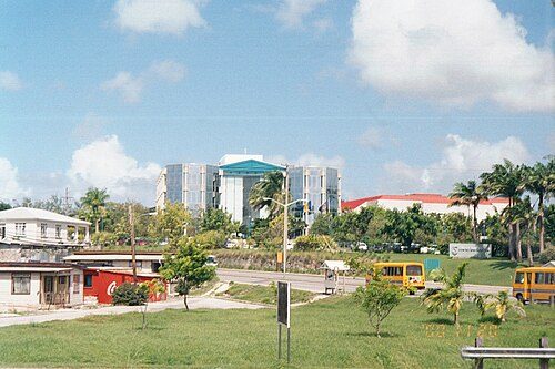 The two 1997 Hino ACME minibuses on the ABC Highway close to the Garfield Sobers Roundabout (sponsored by the then Mutual Life of Barbados; now Sagicor) on 20 November 2000.