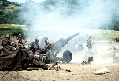 M102 howitzers of 320th Field Artillery Regiment firing during the 1983 invasion of Grenada.