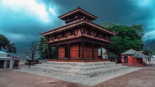 Ambikeshwori Temple, Dang is a Shakta pitha which is supposed to have emerged due to the falling of right ear of Satidevi according to the Swasthani Purana.