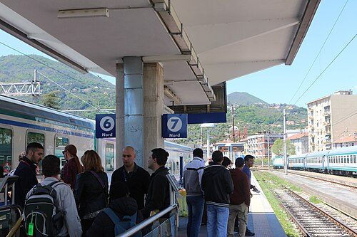 Personnel control the intense flow of tourists on the platforms of the La Spezia Centrale railway station during the public holiday of May Day