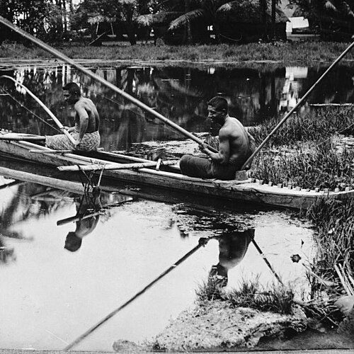 Two men fishing from canoe, 1914