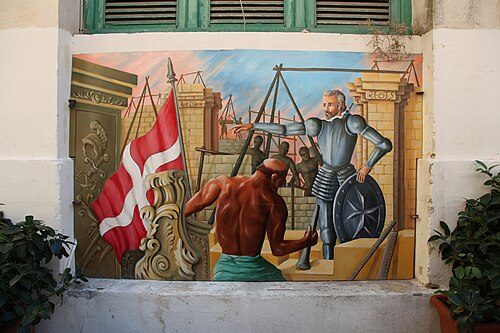 Former mural at Is-Suq tal-Belt illustrating the city's construction