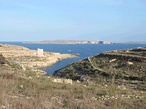 View of Mġarr ix-Xini, with Comino and mainland Malta in the background.