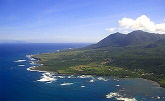 The east coast of Nevis, partially protected by coral reefs with Long Haul Bay visible in the foreground