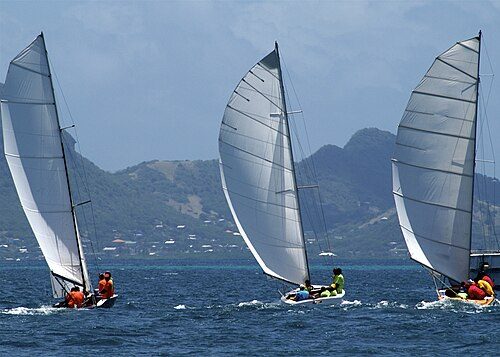 Local sailboats compete in regatta, Union Island in background